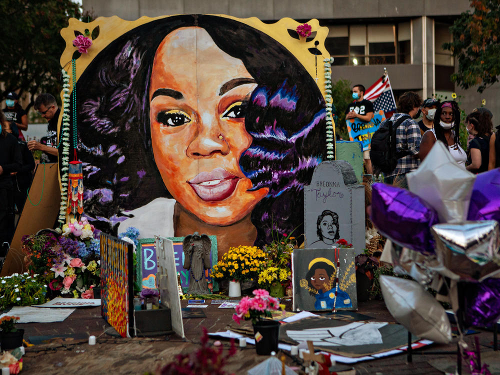 People gather at Breonna Taylors make shift memorial in Injustice Square Park in downtown Louisville.