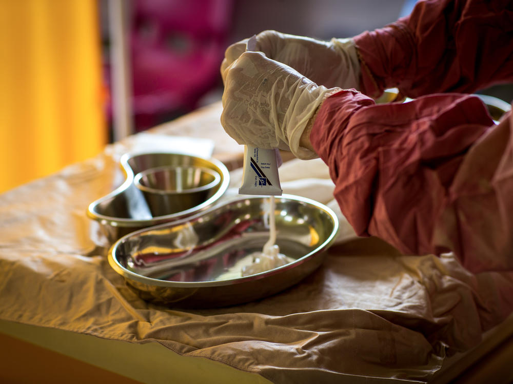 A nurse in the burn unit of the hospital in Afghanistan's Herat province prepares a topical ointment used to treat and prevent infections in burn patients.