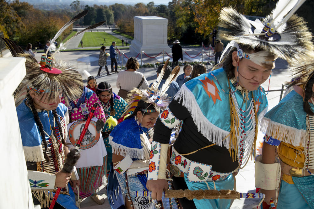 Members of the Crow Nation, who had performed and laid flowers at the Tomb, exit the site.