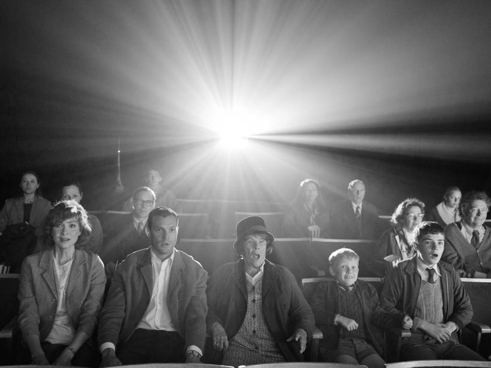 The family (CaitrÃÂ­ona Balfe, Jamie Dornan, Judi Dench, Jude Hill and Lewis McAskie) goes to the movies in <em>Belfast</em>.