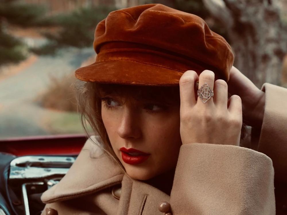 Taylor Swift on the cover of <em>Red (Taylor's Version). </em>