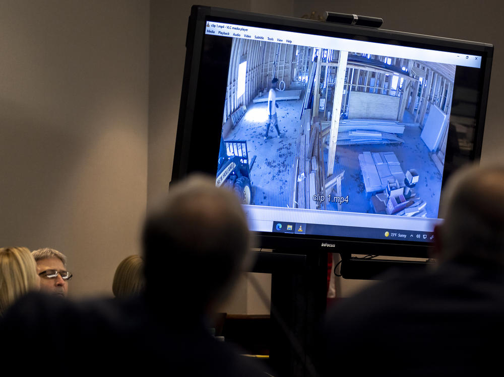 Prosecutors show home surveillance camera footage of Ahmaud Arbery entering a house under construction during the trial.