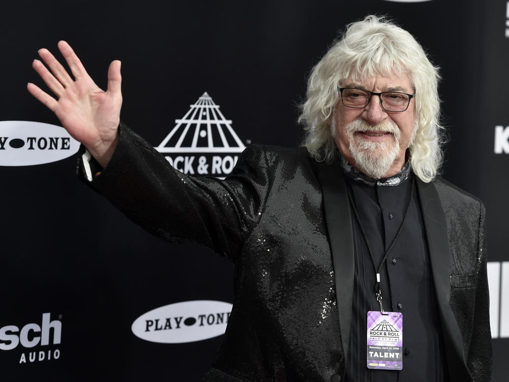 Graeme Edge, drummer for The Moody Blues, waves on the red carpet before the Rock & Roll Hall of Fame induction ceremony April 14, 2018, in Cleveland. The band's frontman, Justin Hayward, confirmed Edge's death Thursday, on the group's website.