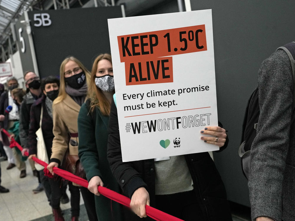 Climate activists demonstrate at the COP26 U.N. Climate Summit in Glasgow, Scotland, Friday. Negotiators from almost 200 nations were making a fresh push to reach agreement on a series of key issues.