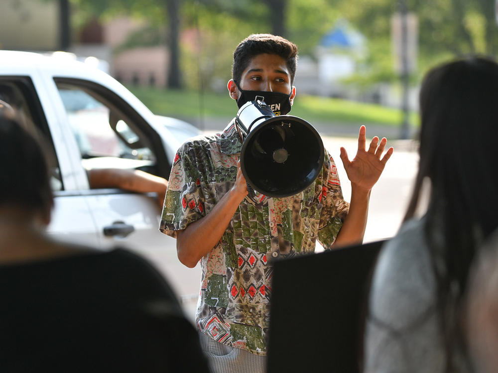University of Kansas undergraduate Marc Veloz speaks at an environmental rally outside Lawrence city hall. He says his interest in activism was driven by concern over the disproportionate effect climate change had on communities of color in his hometown of Dallas.