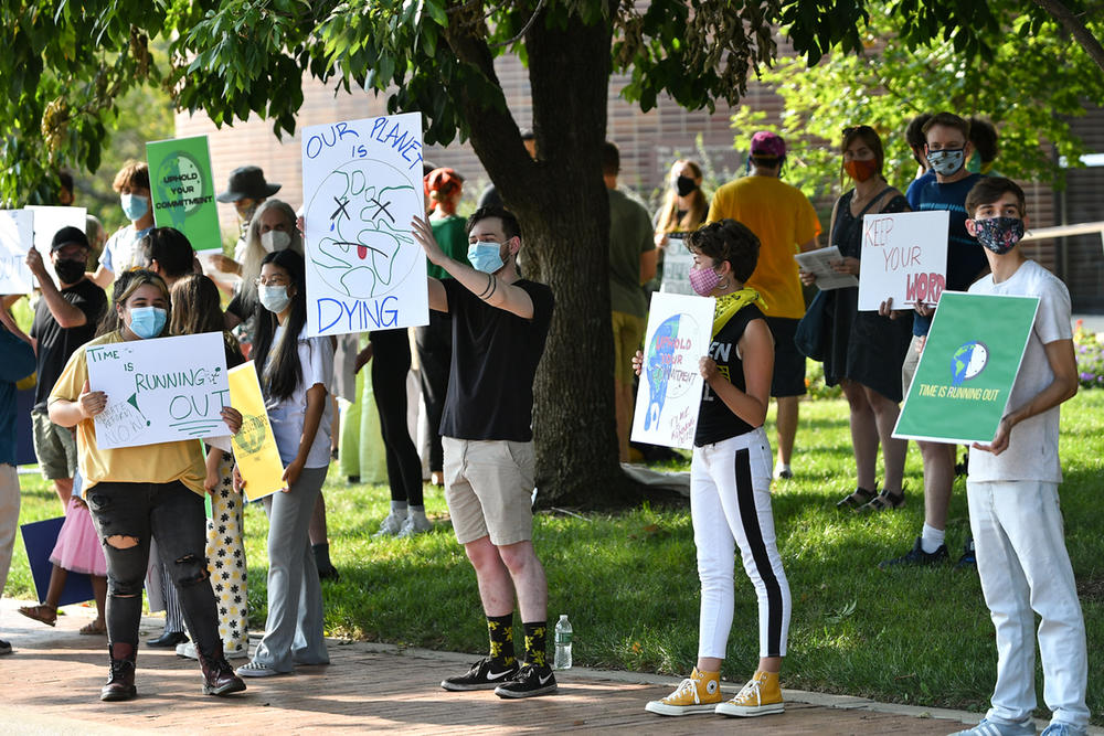 Young activists rallied in front of the Lawrence, Kansas, City Hall to urge city leaders to follow through on sustainability commitments.