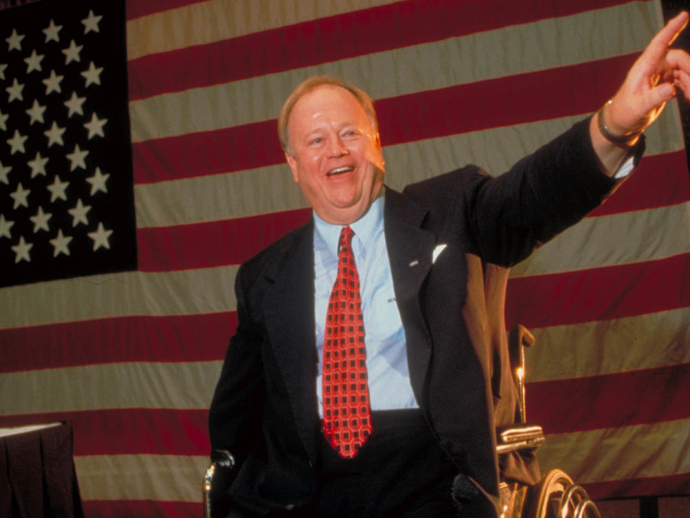 Vietnam War veteran and triple amputee Max Cleland delivers a speech during a campaign appearance. Cleland died on Tuesday at age 79.