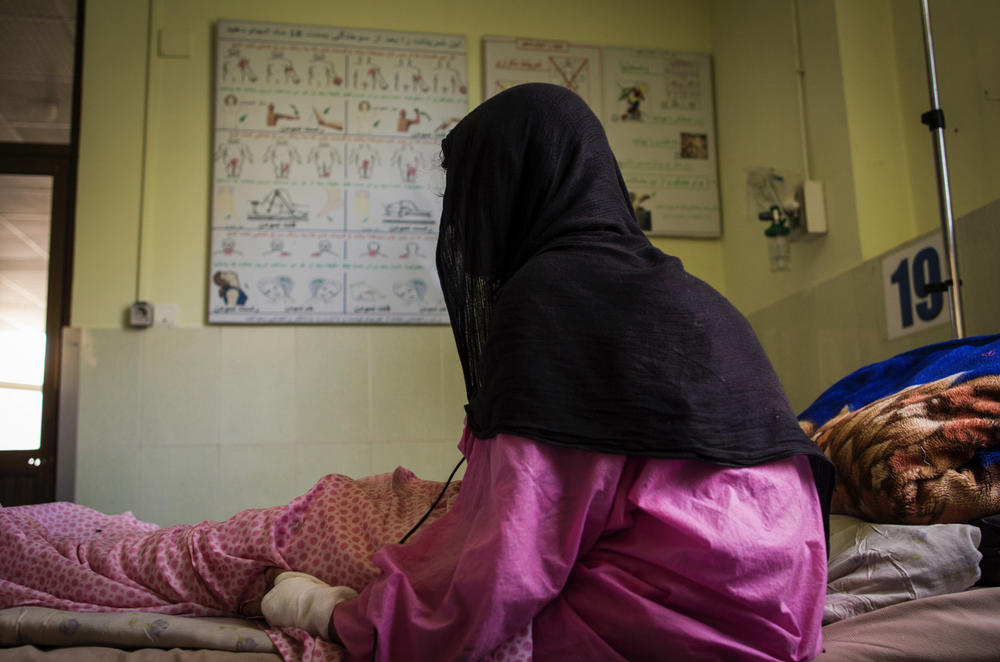 This photograph shows a patient at the Herat burn center in 2017. A mother of five, she says her husband set her on fire using kerosene while she was sleeping.