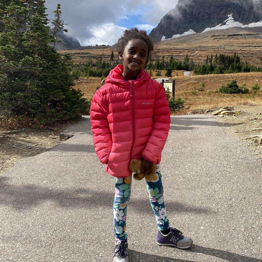 Naomi Pascal holds Teddy during a hike in 2020.