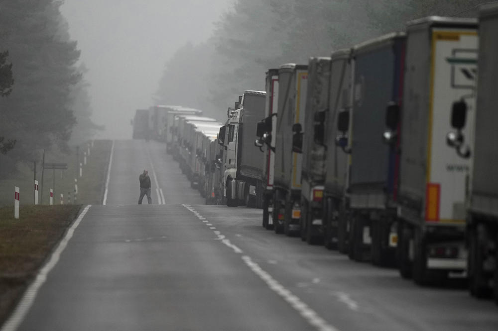 Trucks line up at motorway 65 on their way to the Polish-Belarusian border between Bialystok and Bobrowniki, Poland, Sunday.