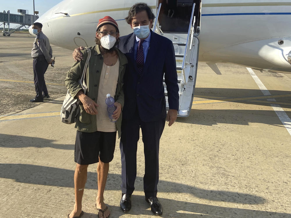 In this photo provided by the Richardson Center, former U.S. Ambassador to the U.N. Bill Richardson, right, poses with journalist Danny Fenster in Naypyitaw, Myanmar, Monday. Richardson said in a statement that Fenster had been released from prison and handed over to him in Myanmar and would be soon on his way home via Qatar.