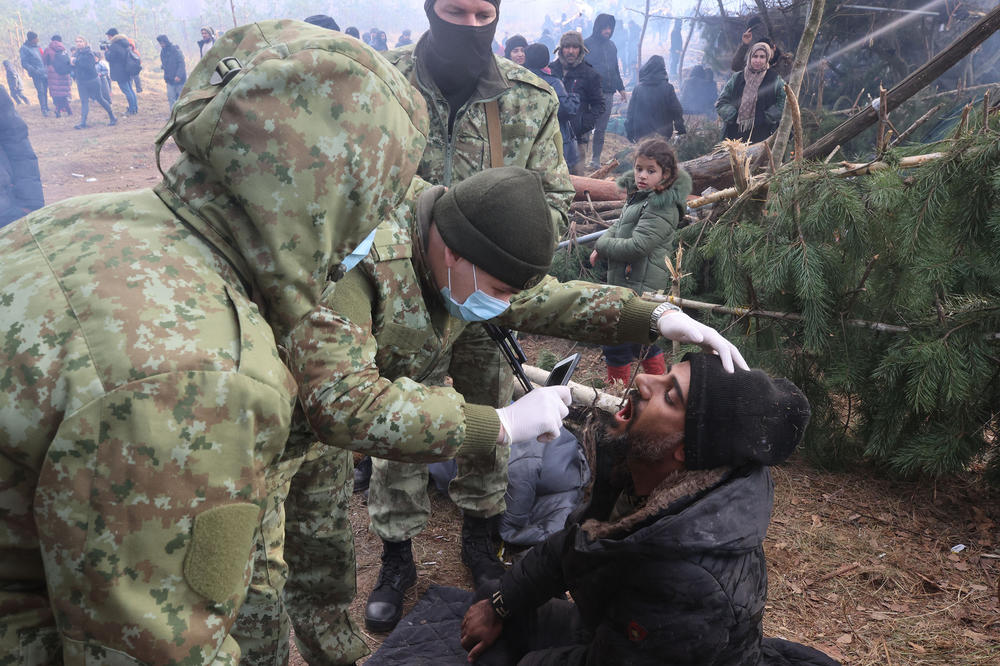 A migrant receives medical attention in a camp on the Belarusian-Polish border in the Grodno region, in Belarus, on Nov. 12.