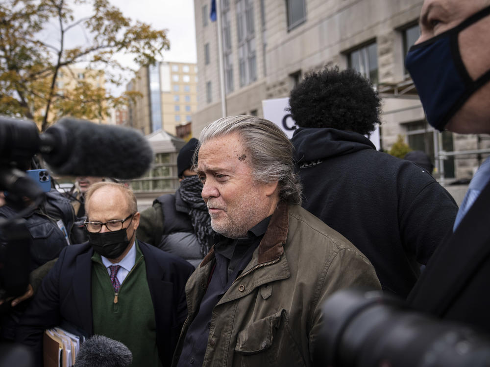 Former Trump administration adviser Steve Bannon surrenders at the FBI Washington Field Office in Washington, D.C., on Monday. He's been charged with two counts of contempt of Congress for defying a subpoena from the Jan. 6 committee.