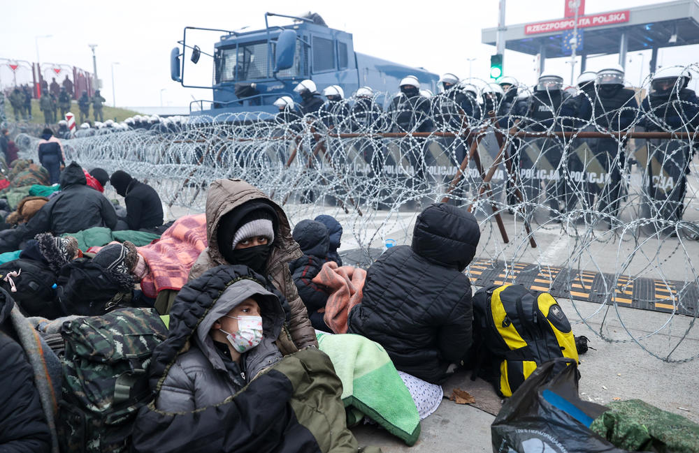 Migrants are at the border checkpoint at Bruzgi, Belarus, and Kuznica, Poland, on Wednesday. They are caught in a border crisis between Belarus and its EU neighbors that began to escalate earlier this month.