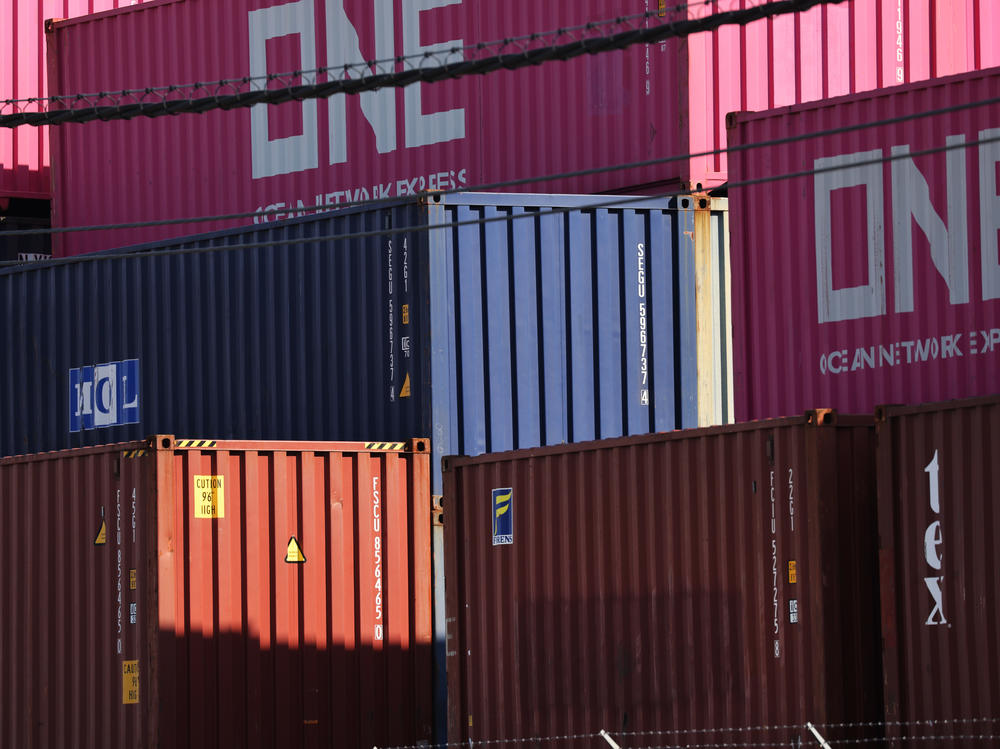 Shipping containers sit stacked at a port in Bayonne, N.J., on Oct. 15. Supply chain problems are disrupting the global economy, causing delays and a shortage of containers.