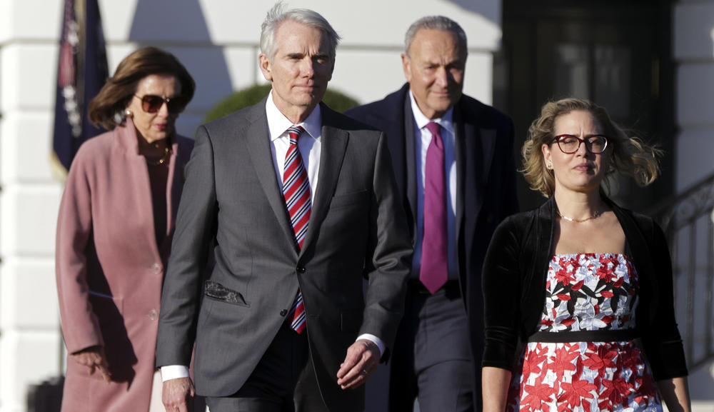 Sens. Rob Portman, R-Ohio, and Kyrsten Sinema, D-Ariz., front, led negotiations that resulted in the infrastructure bill.