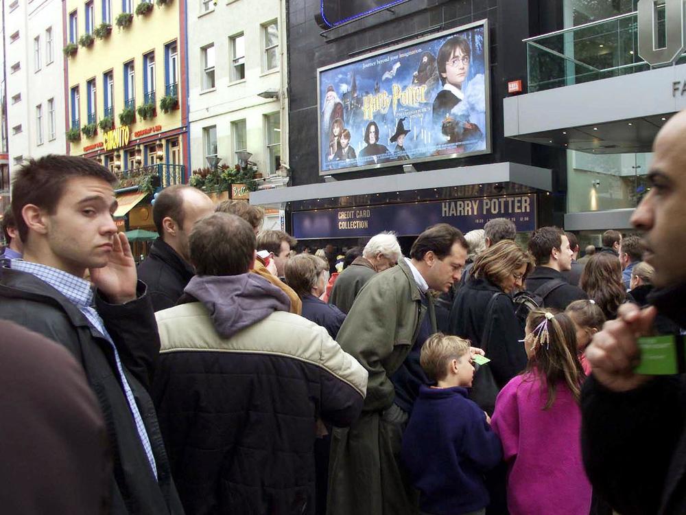 People lined up outside the Odeon cinema in Leicester Square in London's West End for the first public showing of the Harry Potter movie on November 12, 2001.