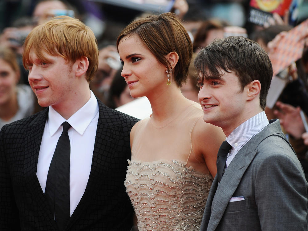 Rupert Grint, Emma Watson and Daniel Radcliffe attend the World Premiere of Harry Potter and The Deathly Hallows - Part 2 at Trafalgar Square on July 7, 2011 in London, England.