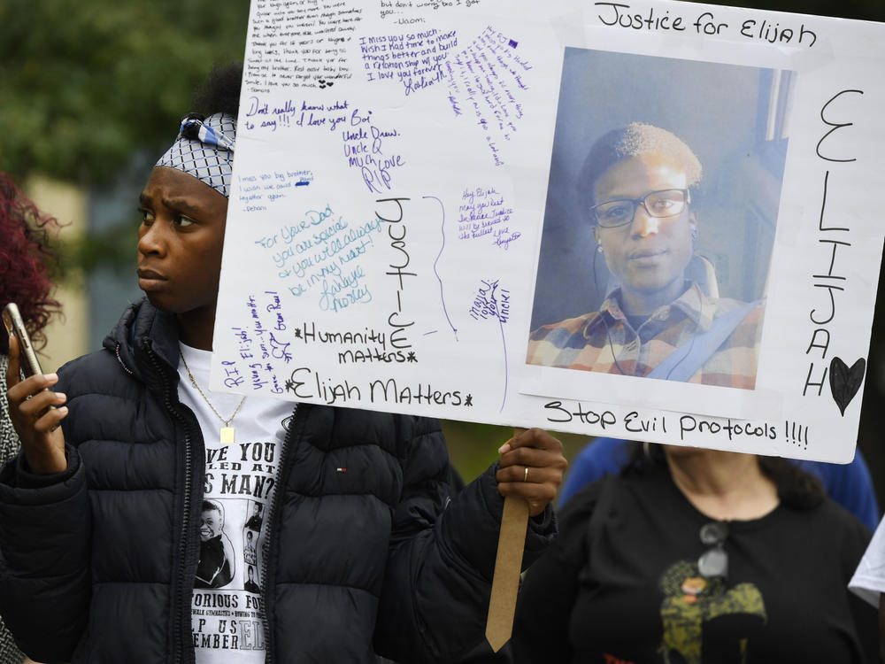 Rashiaa Veal holds a sign of her cousin, Elijah McClain at a October 2019 news conference in front of the Aurora Municipal Center. Family, friends, legal counsel, local pastors and community organizers were calling for justice for the officer-involved death of McClain.