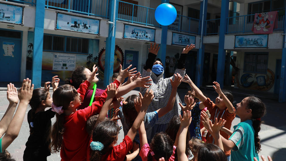Children play at a school run by the United Nations Relief and Works Agency, known as UNRWA, where many displaced Palestinian families sought refuge in Gaza City amid daily airstrikes and bombardment by Israeli forces, on May 19.