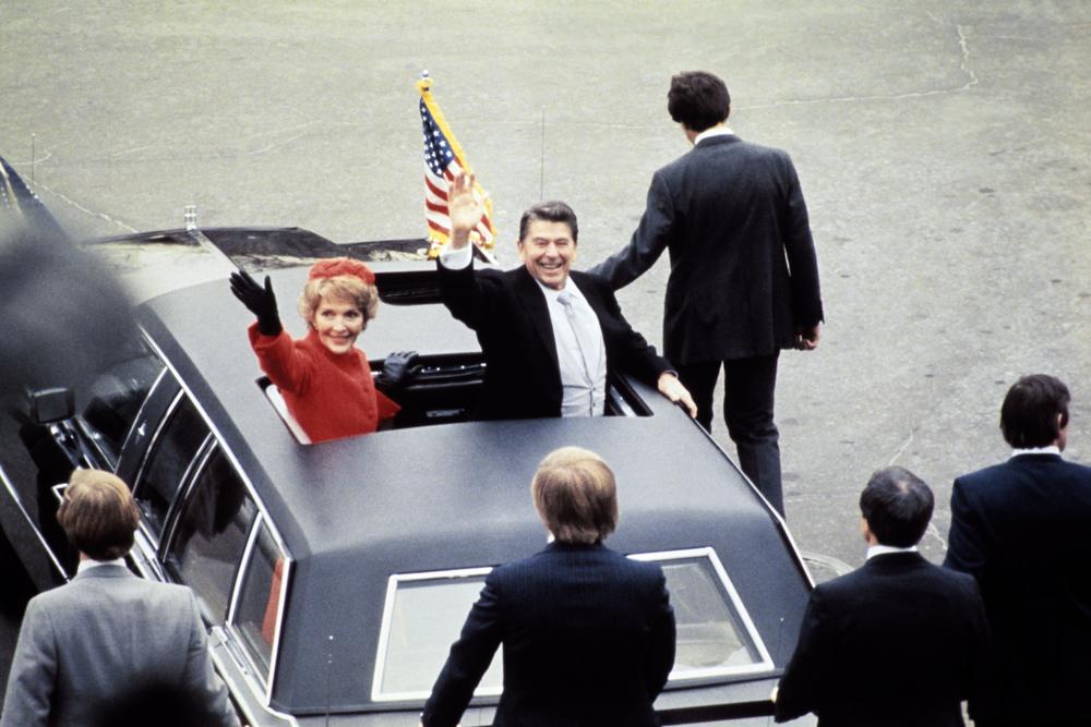 Ronald Reagan beside his wife Nancy Reagan after Reagan's inauguration in 1981. Reagan's victory over incumbent Jimmy Carter was due, in part, to Carter's handling of the economy and inflation.