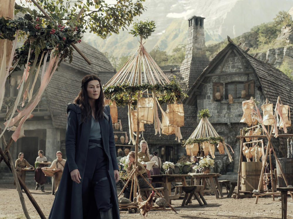 Moiraine (Rosamund Pike) visits a remote village in search of something — or someone — in Amazon's <em>The Wheel of Time</em>.