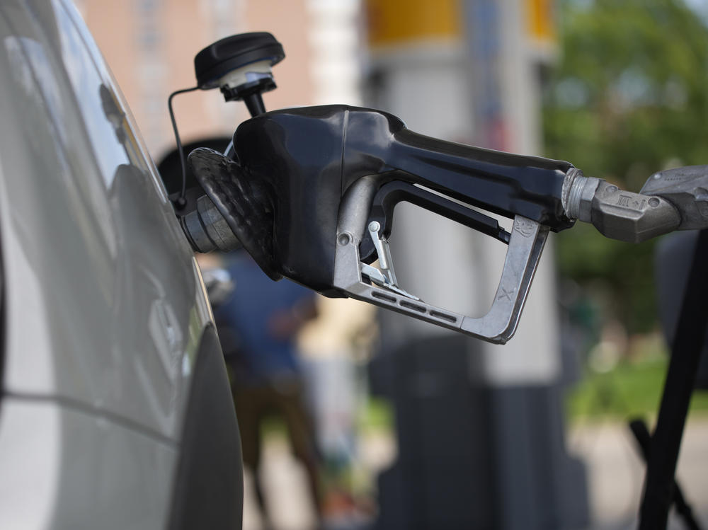 Motorists fill up their vehicles at a Shell station on July 22 in Denver. Phasing out the sale of gas-powered cars once seemed laughable. It's now inching closer to reality.