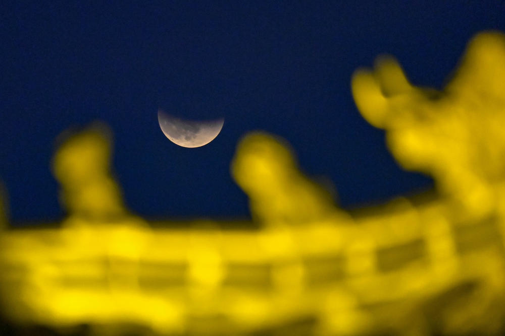 A partial lunar eclipse is seen in the sky above Qingzhou City, East China's Shandong Province.