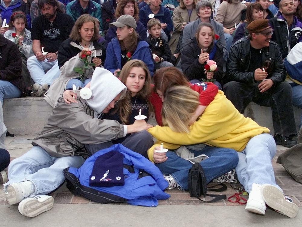 Denver area residents gather the day after the April 20, 1999 shooting at Columbine High School.