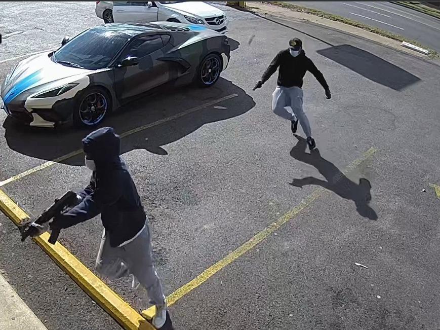 The Memphis Police Department attained surveillance video showing two armed suspects getting out of a white two-door Mercedes Benz and approaching rapper Young Dolph while he was inside Makeda's Cookies.