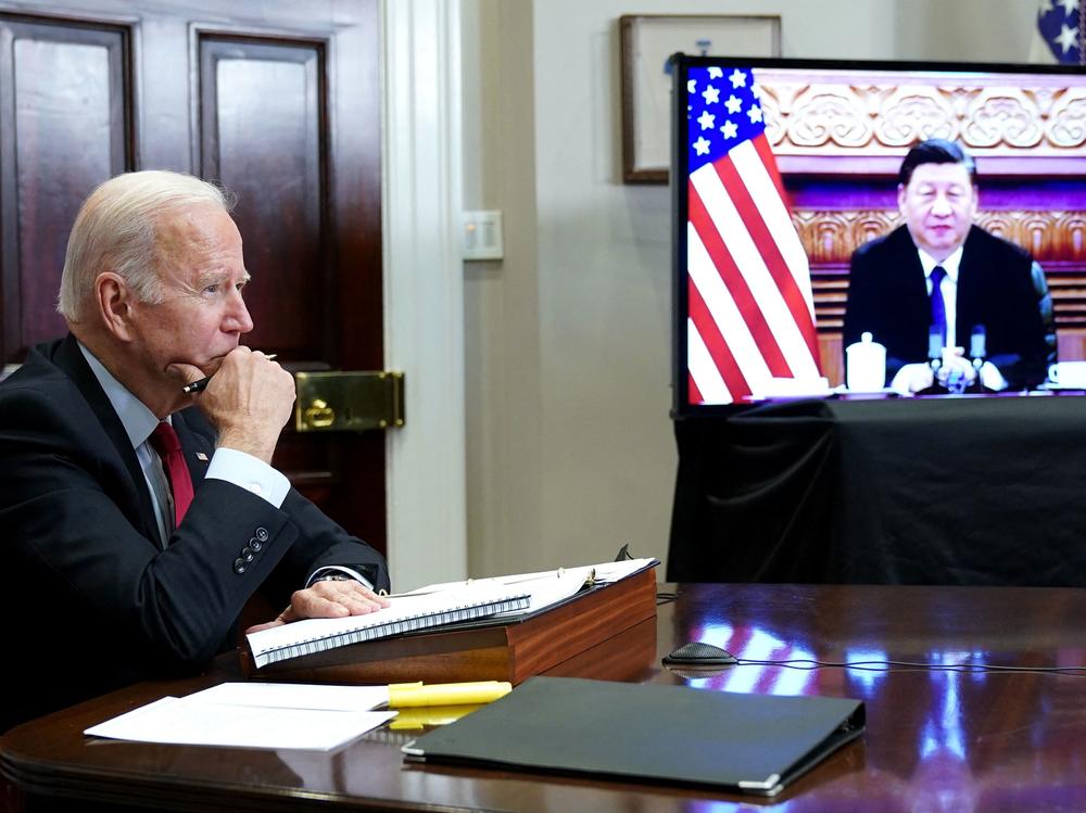 President Biden meets with China's President Xi Jinping during a virtual summit from the Roosevelt Room of the White House in Washington, D.C. on Nov. 15. The White House has been asking other countries to tap their emergency oil stockpiles in a coordinated fashion. China is reportedly considering such a release, though it's not clear whether it's responding to the U.S.