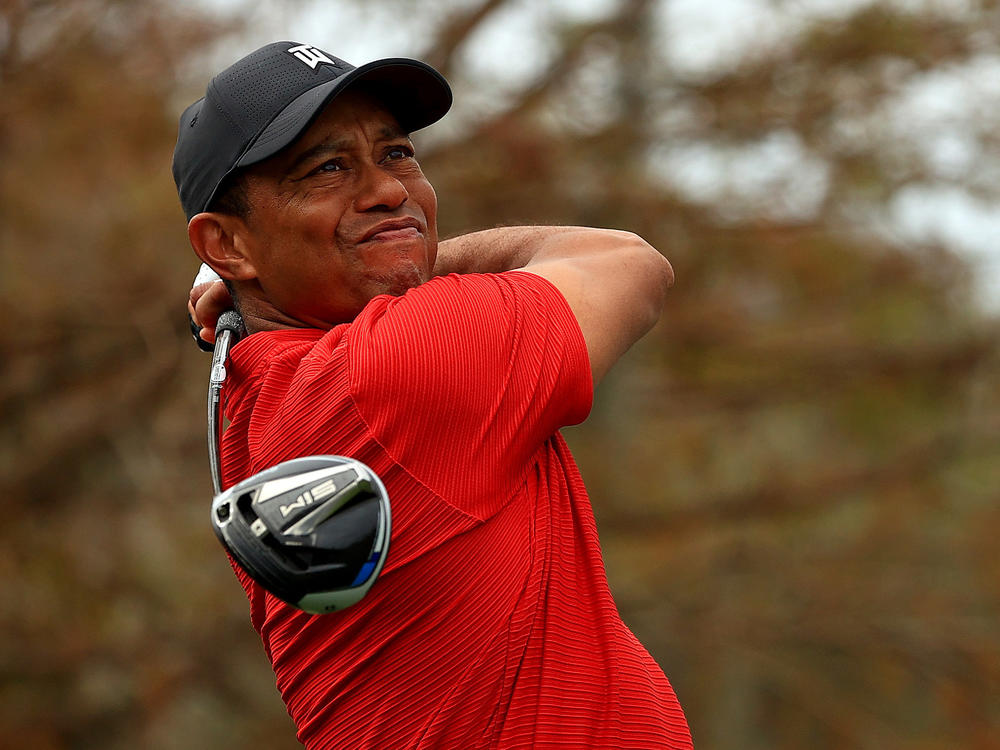 Tiger Woods, pictured in December 2020, posted a video on Sunday of himself practicing. He faced complex injuries sustained in a car crash in February.