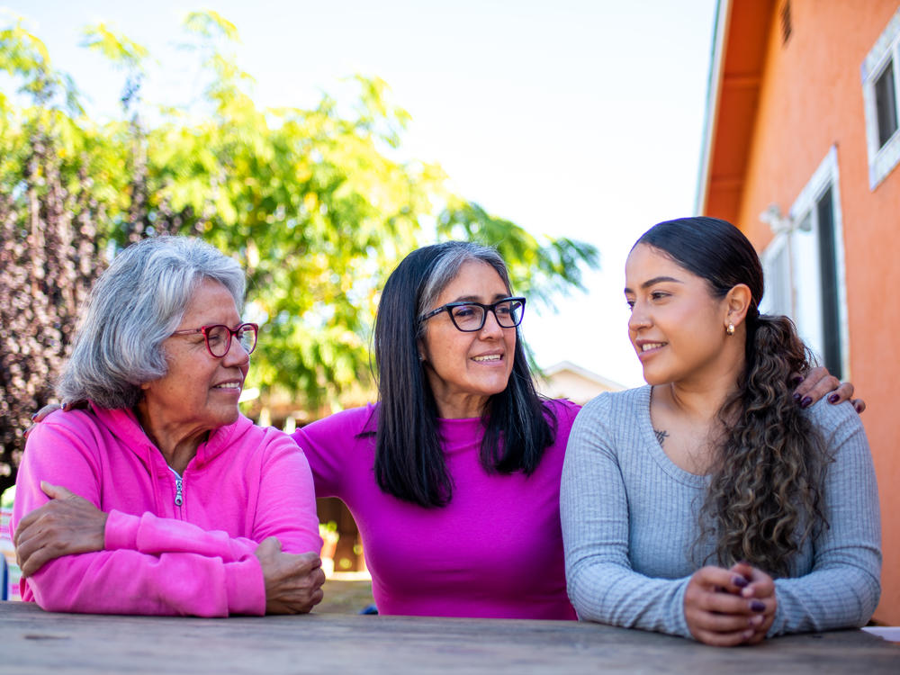 Three generations, (from left to right) grandmother Genoveva Calloway, daughter Petra Gonzales, and granddaughter Vanesa Quintero, live next door to each other in San Pablo, Calif. Recently their extended family was hit with a second wave of COVID infections a year after the first.