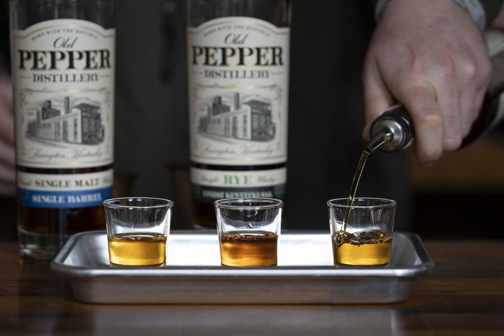 Travis Kitchens pours a tasting flight at the James E. Pepper Distillery.