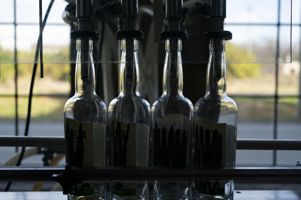Bottles sit on bottling line at the James E. Pepper Distillery.