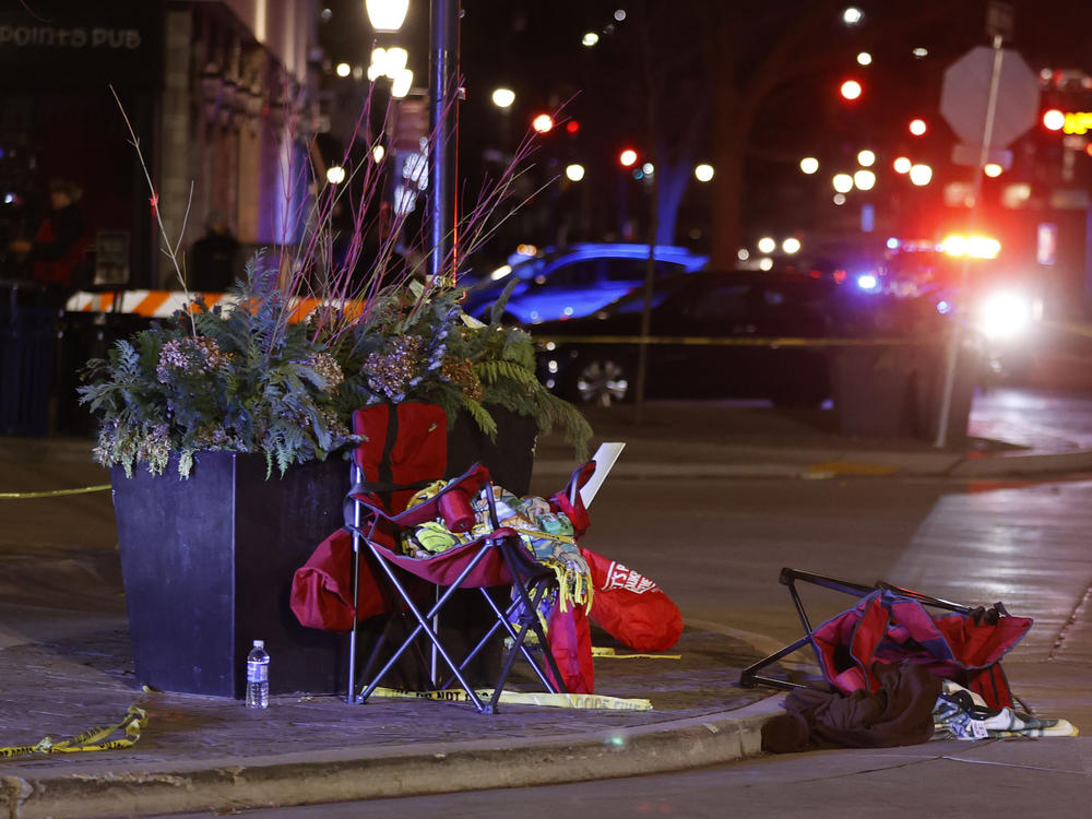 Toppled chairs are seen among holiday decorations in downtown Waukesha, Wis., after an SUV plowed into a Christmas parade injuring dozens of people Sunday.