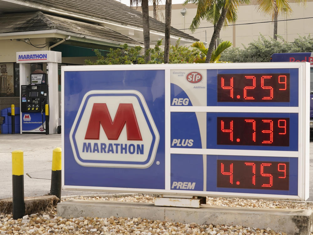 Gasoline prices are seen on Nov. 17 in Miami Beach, Fla. The White House says oil prices have come down as speculation grew that the United States and other countries would tap reserves.