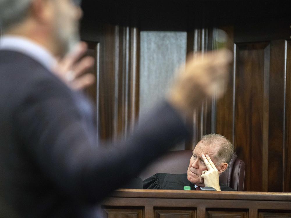 Superior Court Judge Timothy Walmsley listens to defense attorney Jason B. Sheffield as he presents a closing argument to the jury during the trial of Travis McMichael; his father, Gregory McMichael; and William 