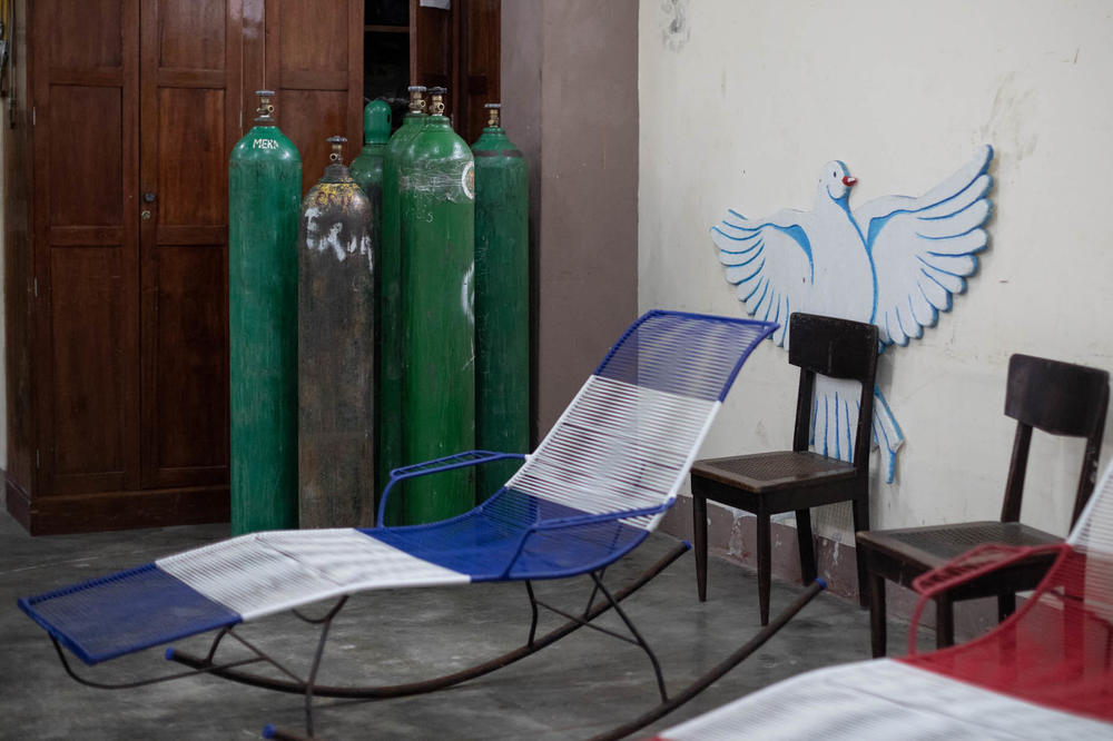 A shortage of oxygen contributed to Peru's high death rate. Above: empty oxygen tanks in the medical office in the San Martin de Porres church in Iquitos.