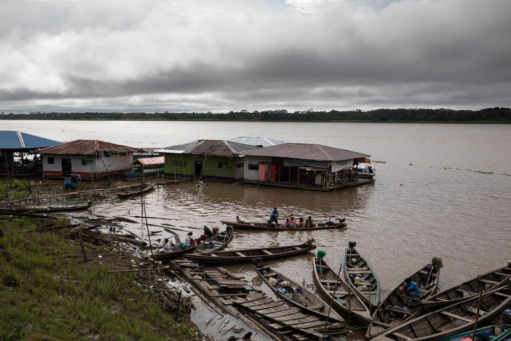 Boats anchored in the port of Indiana down the Amazon river from Iquitos, Peru. Iquitos is only accessible by air or water. Residents thought that that isolation might slow the arrival of COVID-19, but that didn't prove to be the case.