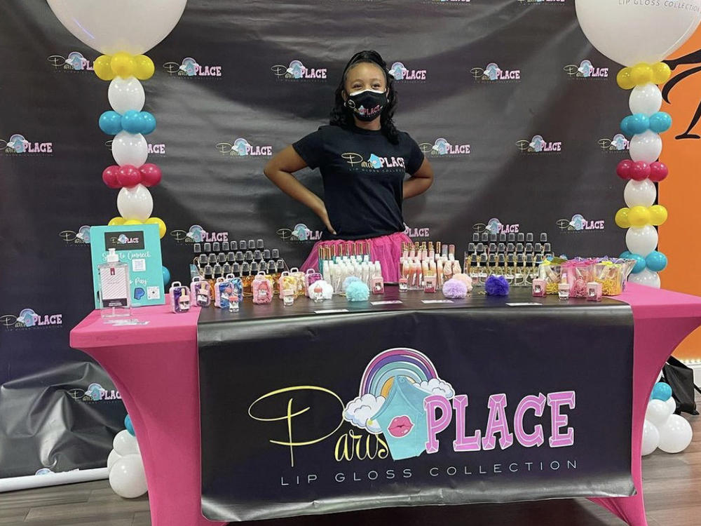 Paris Muhammad, CEO of Paris Place LLC, at the ribbon-cutting ceremony celebrating the moment she made history as the youngest member of the Conyers-Rockdale Chamber of Commerce in Georgia.