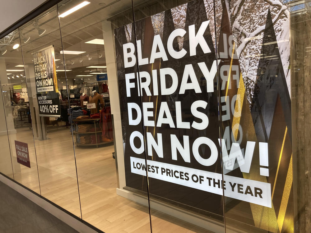 A sign promote sales at a clothing store in a Colorado mall.