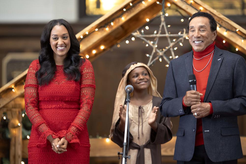 Tia Mowry and Smokey Robinson in <em>Miracle in Motor City.</em>