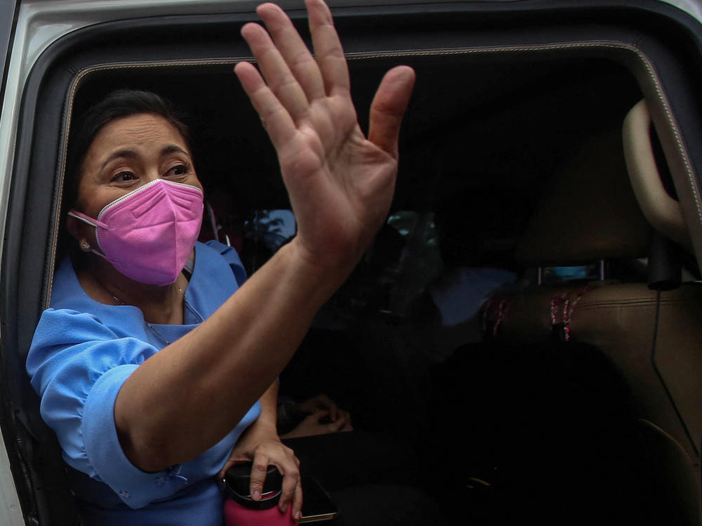 Philippine Vice President Leni Robredo gestures to a crowd of supporters in Manila on Oct. 7, 2021, the day she filed her candidacy for the 2022 presidential race.