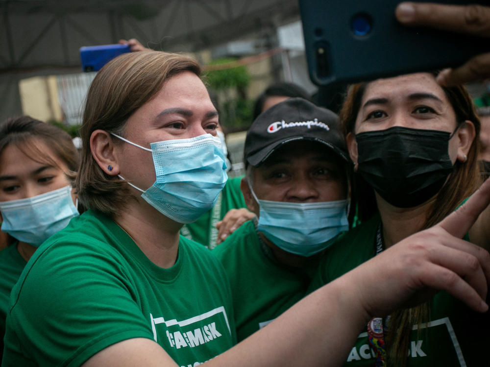 Sara Duterte poses for a selfie with city hall employees in Davao city, on the southern island of Mindanao.