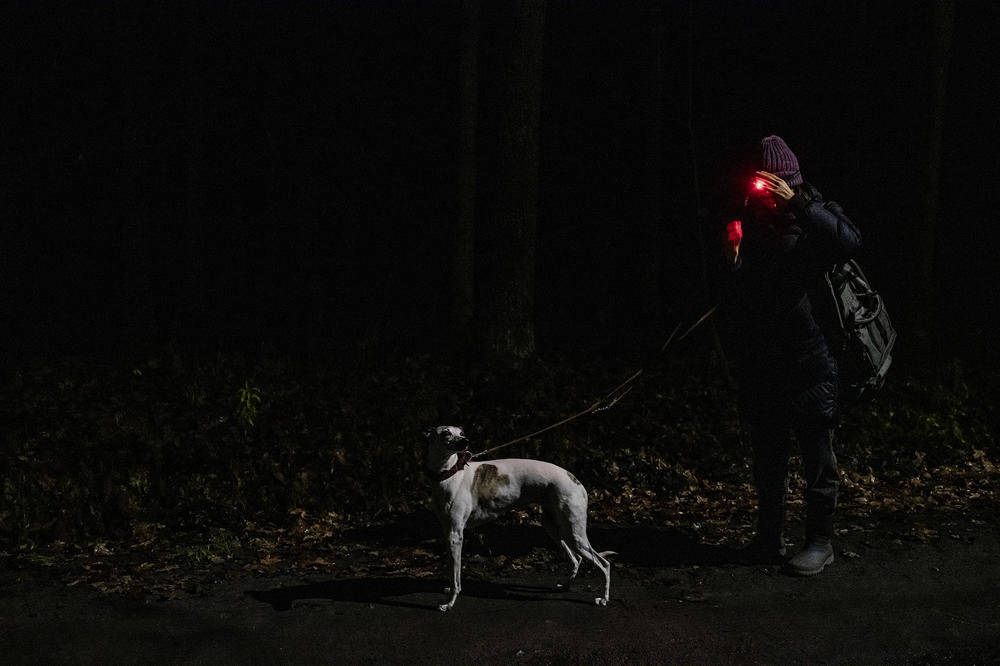 Kasia Wappa prepares to enter a local forest trying to find people who asked for help. This was known as a 