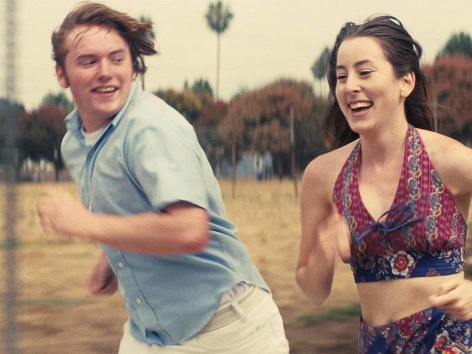 Cooper Hoffman and Alana Haim are unlikely friends in <em>Licorice Pizza.</em>