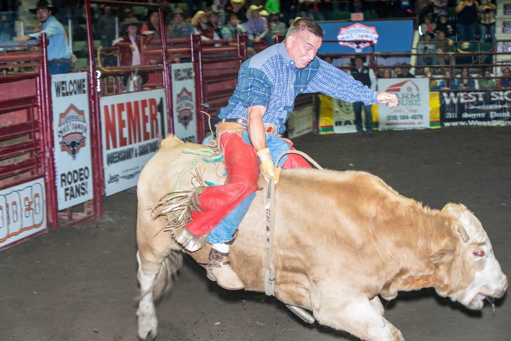 A bull rider competes at the Adirondack Stampede in the Cool Insuring Arena.