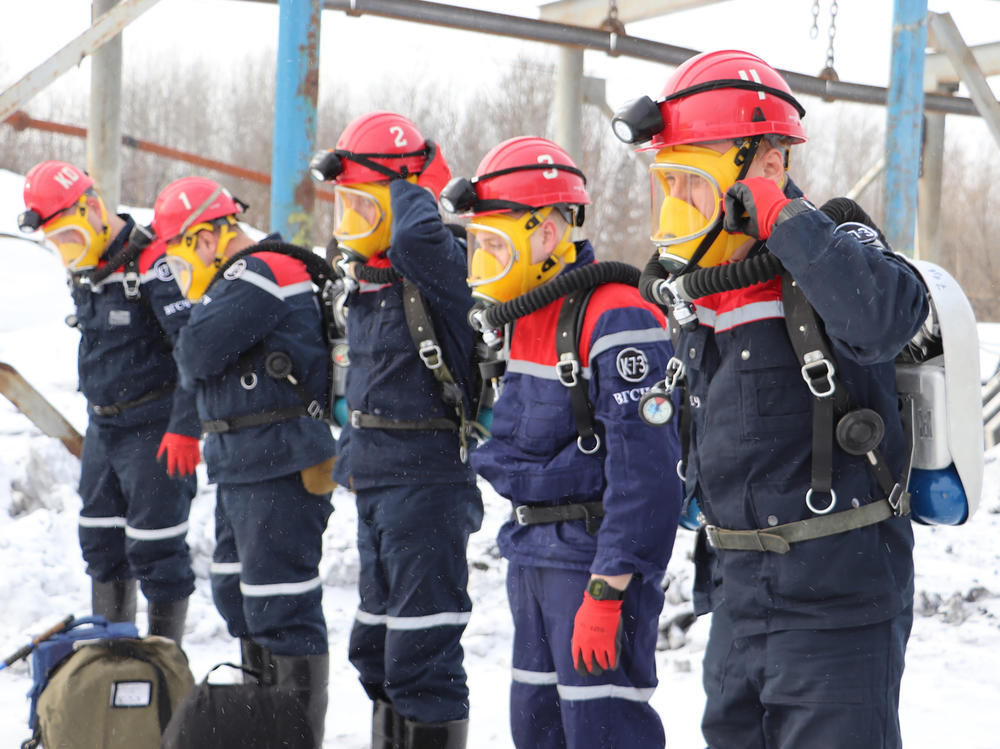 In this Russian Emergency Situations Ministry Thursday, Nov. 25, 2021 photo, rescuers prepare to work at a fire scene at a coal mine near the Siberian city of Kemerovo, about 3,000 kilometres (1,900 miles) east of Moscow, Russia,. Russian authorities say a fire at a coal mine in Siberia has killed nine people and injured 44 others. Dozens of others are still trapped.