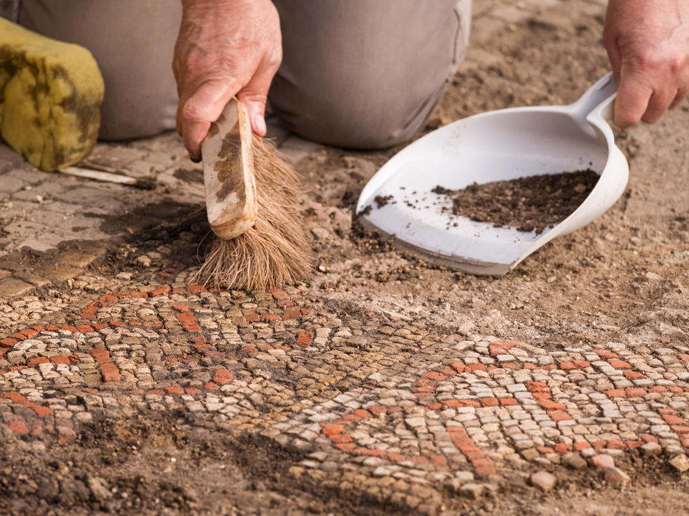 Rutland Villa Project. A member of the team from ULAS/University of Leicester during the excavations of a mosaic pavement.